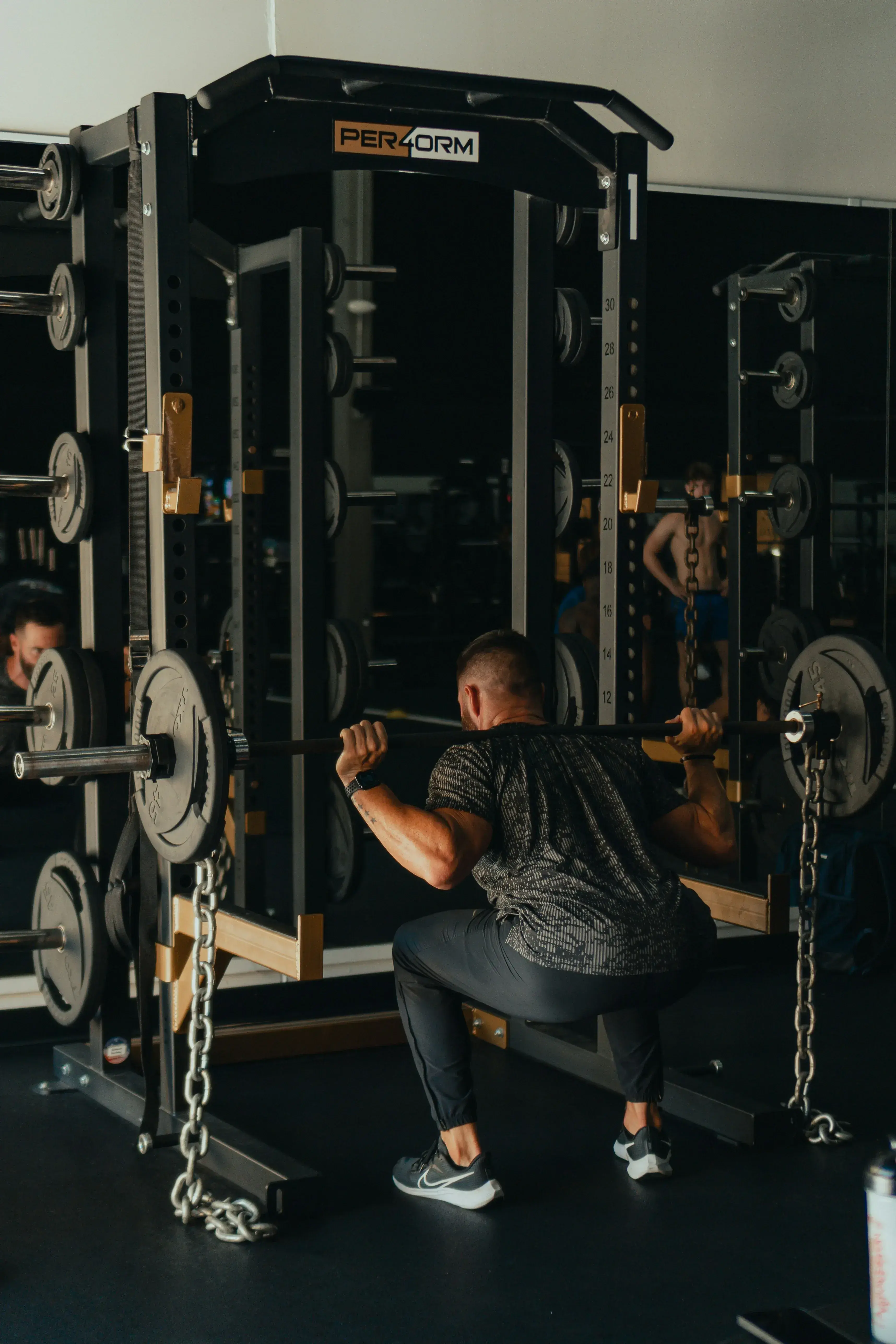 Member squatting during gym session